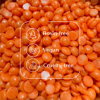 Tangerine Tease orange hard wax beads from Sexy Smooth Wax highlighting the rosin-free, vegan-friendly, and cruelty-free formula.